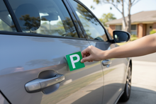 Load image into Gallery viewer, Hand Placing Green P Plate
