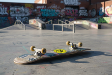 Load image into Gallery viewer, Hazard Symbol on Skateboard

