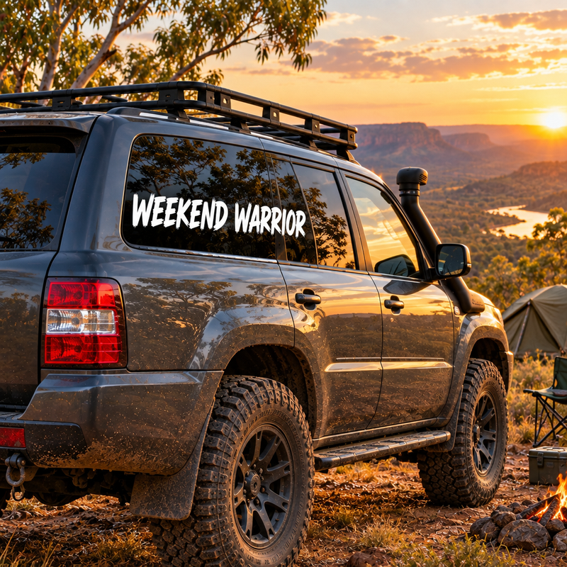 Name on car Sticker side window with a white Weekend Warrior vinyl decal at an Australian bush campsite.