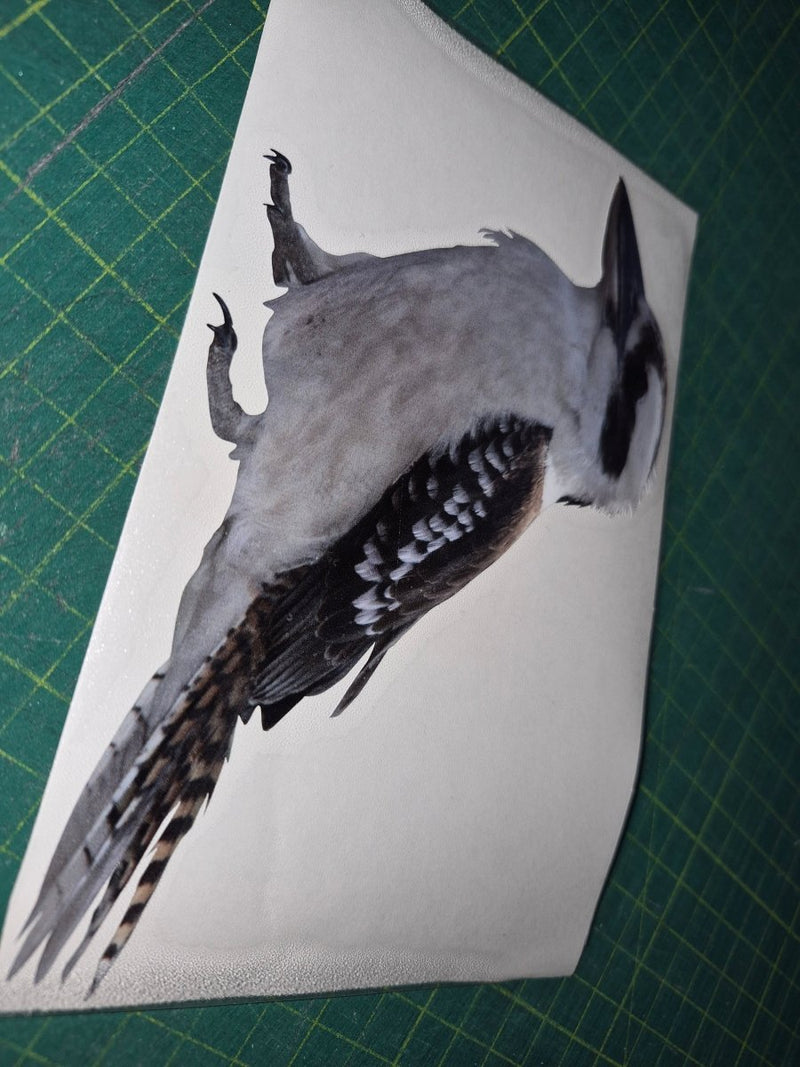 Bird illustration on a white card with a green cutting mat background