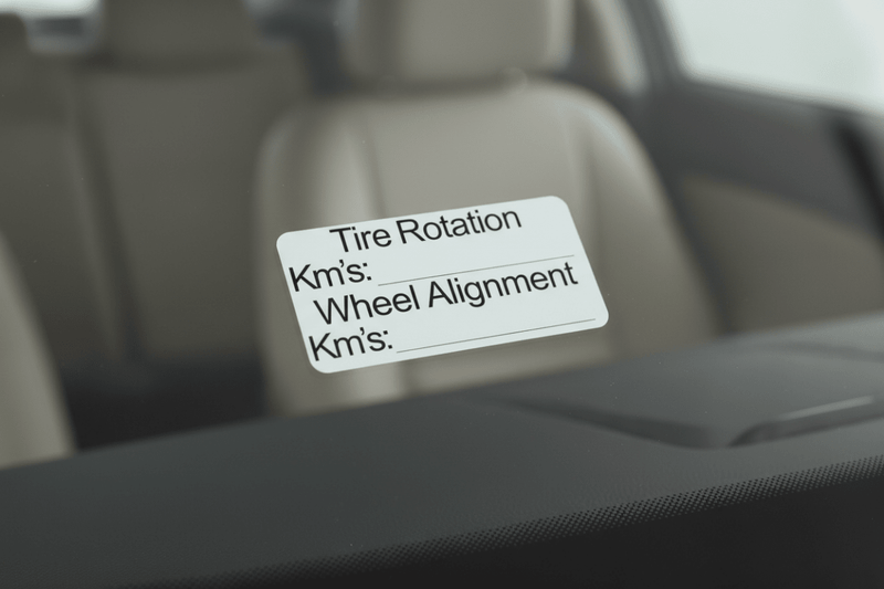 Macro close-up Tire Rotation & Wheel Alignment Stickers