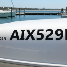 Load image into Gallery viewer, Person holding three sizes against boat hull

