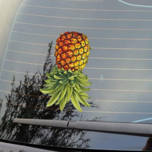 pineapple decal upside-down on a window