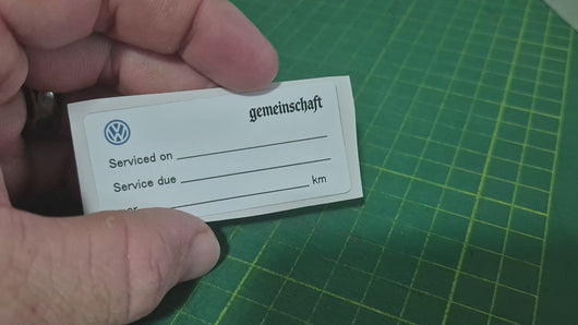 Double-sided service due sticker video showing front and back with custom logo and service details for automotive businesses