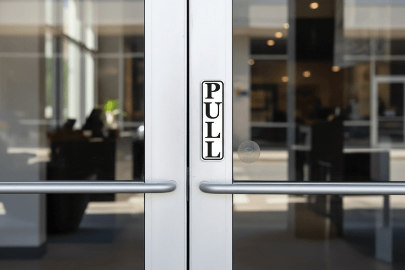 PULL Sign on Glass Door
