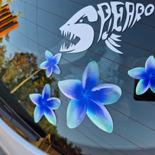 Load image into Gallery viewer, Frangipani Blue flower decals on a car window with a shark decal above them.
