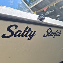 Load image into Gallery viewer, Boat with 'Salty Starfish' decal on a docked boat.
