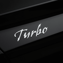 Load image into Gallery viewer, Silver Gothic Turbo sticker on black car panel
