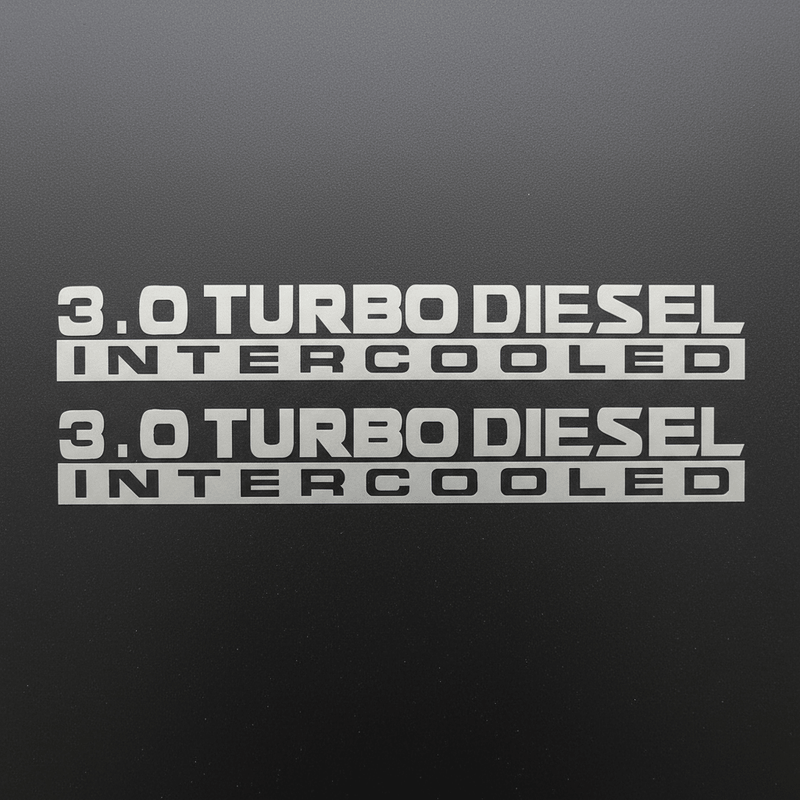Silver-grey 3.0 Turbo Diesel Intercooled stickers on dark background