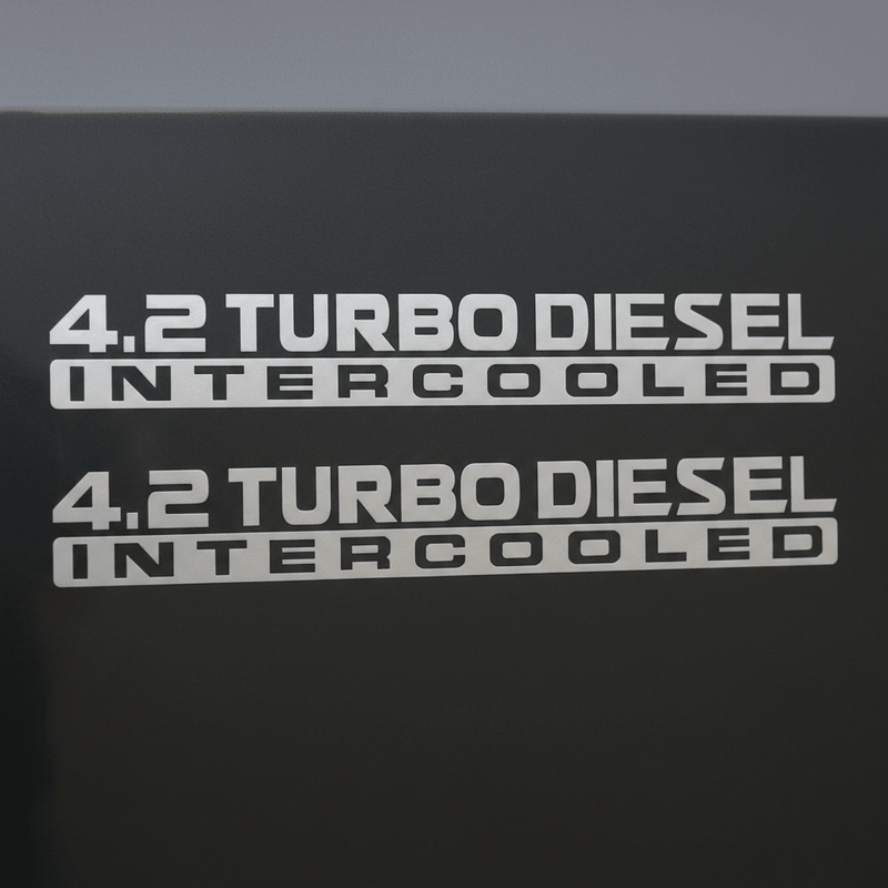 Silver-grey 4.2 Turbo Diesel Intercooled stickers on dark background