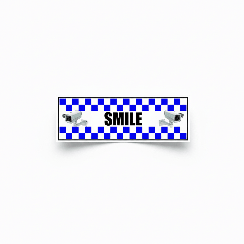 Another bold 'SMILE' on camera security STICKER variation shown on a neutral white background