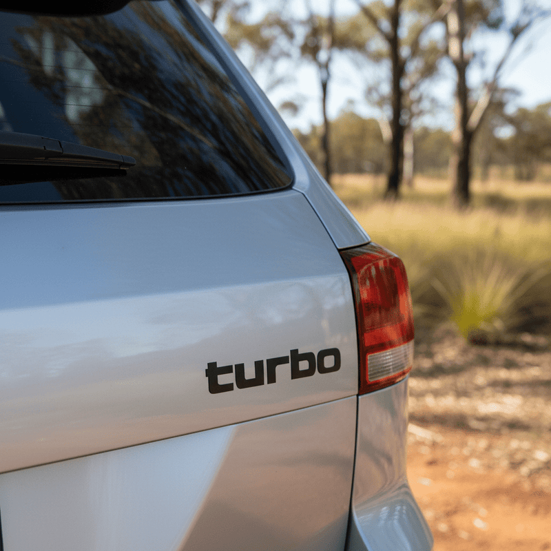 Small black turbo sticker on 4WD rear tailgate