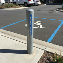 Load image into Gallery viewer, Sticker on car park post near disabled bay
