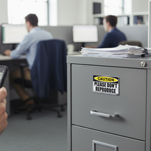 Load image into Gallery viewer, Sticker on filing cabinet
