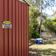 Load image into Gallery viewer, Sticker on shed door
