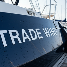 Load image into Gallery viewer, Trade Wind - navy hull close-up white block letters
