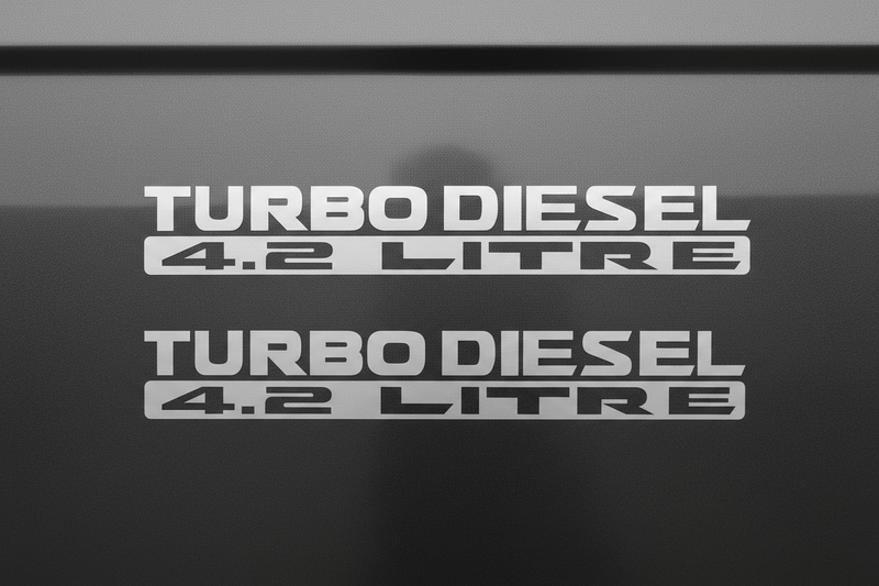 Two satin silver Turbo Diesel 4.2 Litre stickers stacked