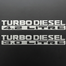 Load image into Gallery viewer, Two silver-grey Turbo Diesel 3.0 Litre stickers stacked
