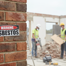 Load image into Gallery viewer, Warning Asbestos on brick wall
