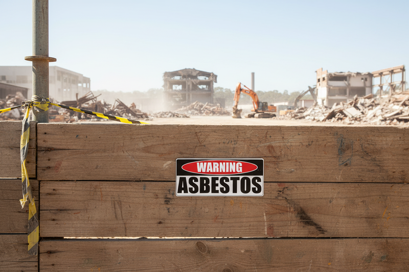 Warning Asbestos on wooden hoarding