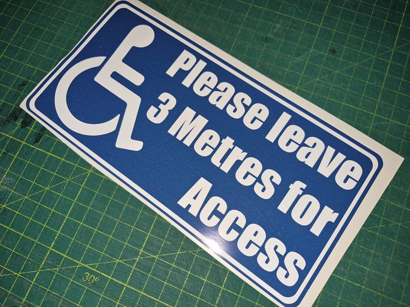 Handicap access sign with text 'Please leave 3 Metres for Access' on a blue background.