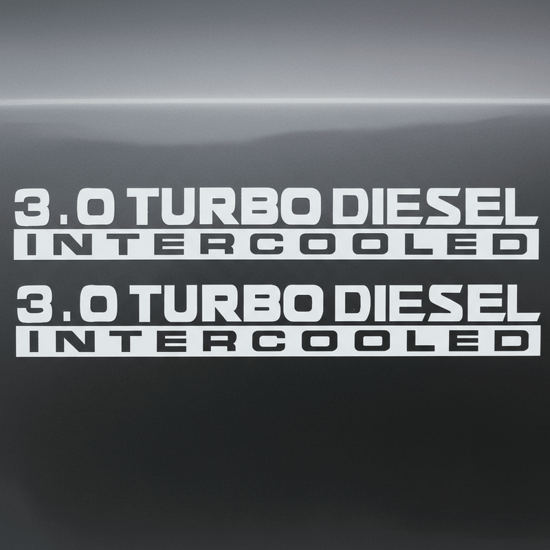 White 3.0 Turbo Diesel Intercooled stickers on dark background