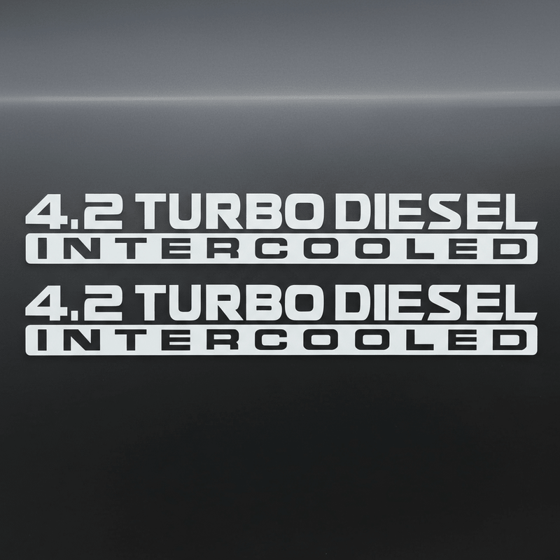 White 4.2 Turbo Diesel Intercooled stickers on dark background